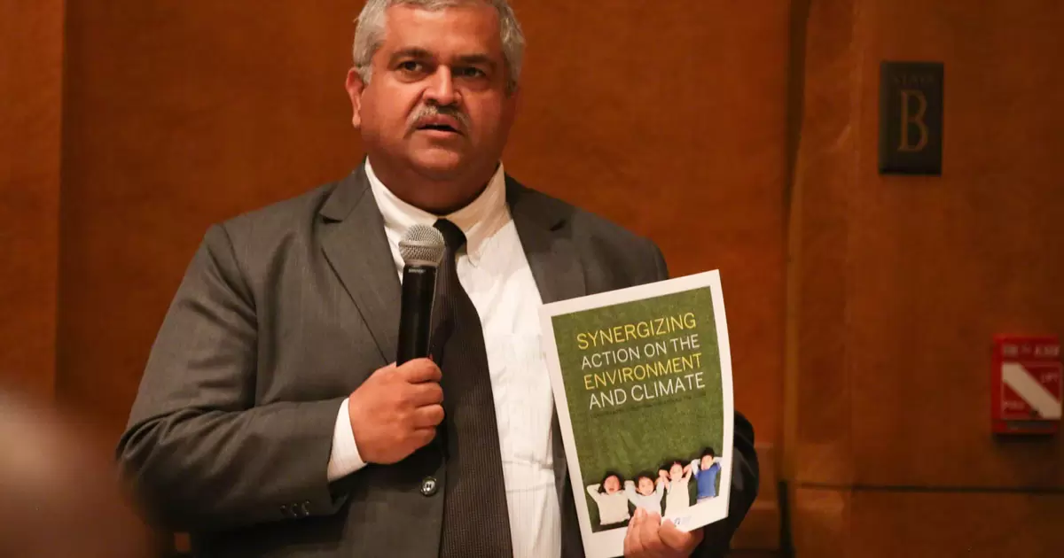 Mr. Satya Tripathi, Assistant Secretary-General United Nations Environment Programme, discussing the report. (IISD/ENB| Kiara Worth)
