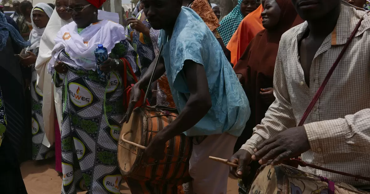 Drummers greet people at the launch of a clean cookstoves project Mararraban-Burum village, Nigeria